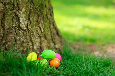 Easter celebration. Painted eggs on green grass, space for text