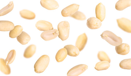 Many peanuts in the air on white backgroundの写真素材