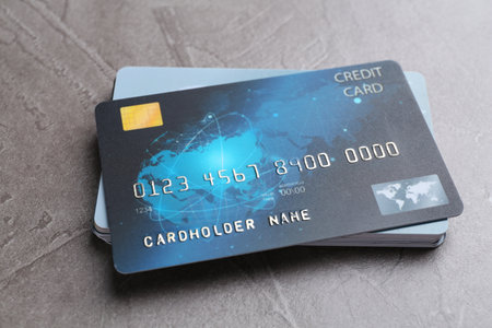 Credit cards on grey textured table, closeupの写真素材