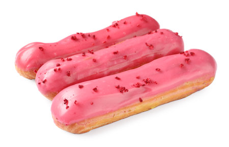 Delicious eclairs covered with pink glaze isolated on whiteの写真素材