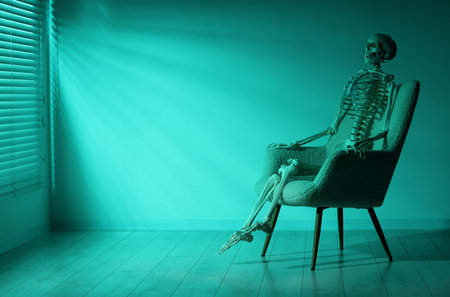 Waiting concept. Human skeleton sitting in armchair indoors, space for textの写真素材