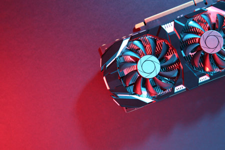 Computer graphics card on color background, top view. Space for text