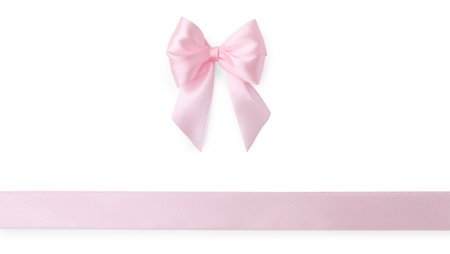 Pink satin ribbon with bow isolated on white, top viewの写真素材