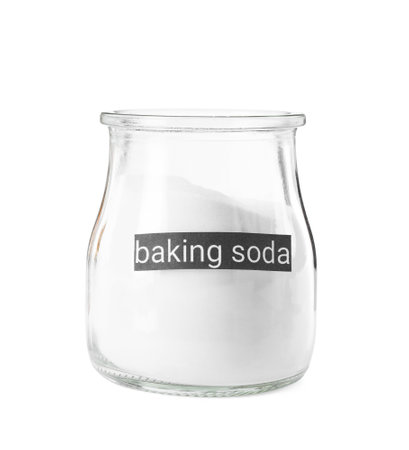 Baking soda in glass jar isolated on whiteの写真素材