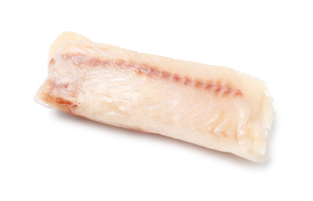 Piece of raw cod fish isolated on white, top view