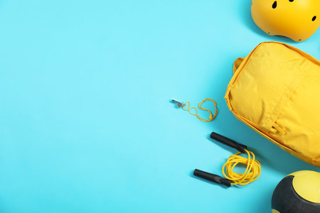 Different sports equipment on light blue background, flat lay. Space for textの写真素材
