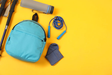 Different sports equipment on yellow background, flat lay. Space for textの写真素材