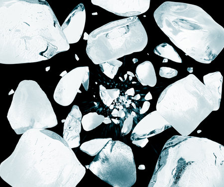 Crushed ice in air on black backgroundの写真素材