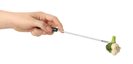Tasty fondue. Woman holding fork with broccoli and melted cheese on white background, closeupの写真素材