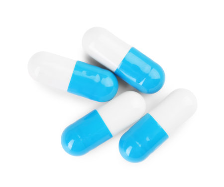 Antibiotic pills isolated on white, top viewの写真素材