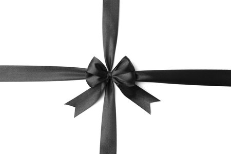 Black satin ribbon with bow isolated on white, top viewの写真素材