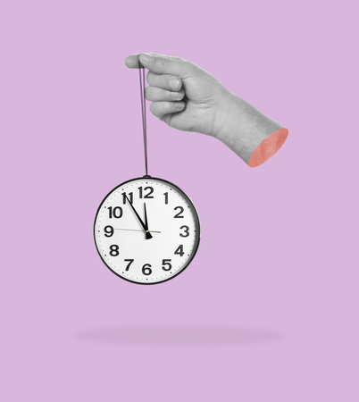 Man holding clock in hand on color background. creative art designの写真素材