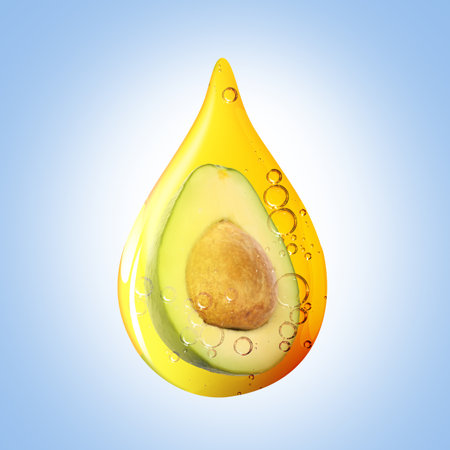Cooking oil drop with half of avocado inside on light blue backgroundの写真素材