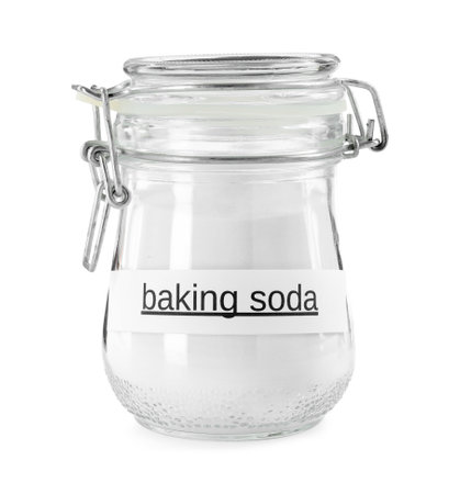 Baking soda in glass jar isolated on whiteの写真素材