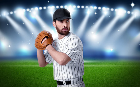 Professional baseball player with glove on stadium