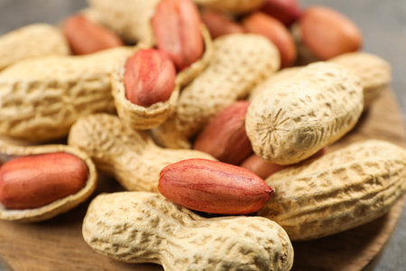 Fresh unpeeled peanuts on table, closeup viewの写真素材