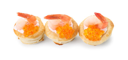 Delicious puff pastry with shrimps, cream cheese and red caviar isolated on whiteの写真素材