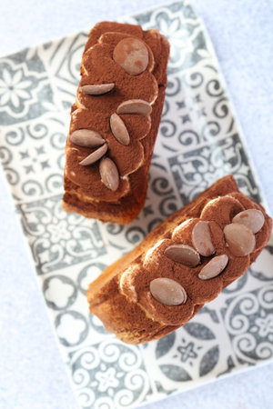 Supreme croissants with chocolate chips and cream on gray table, top view. Tasty puff pastry