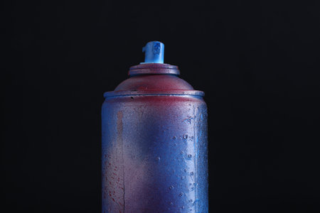 One spray paint can on dark background, closeupの写真素材