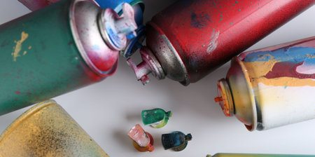 Many spray paint cans on white background, flat layの写真素材