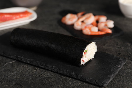 Tasty sushi roll on dark textured table, closeupの写真素材