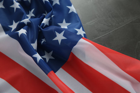 Flag of USA on black table, closeup. Space for text