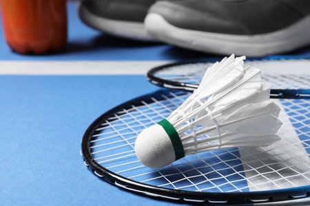 Feather badminton shuttlecock and rackets on court, closeupの写真素材
