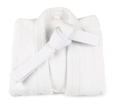 Karate belt and kimono on white background, top viewの写真素材