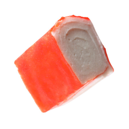 Piece of tasty crab stick isolated on whiteの写真素材