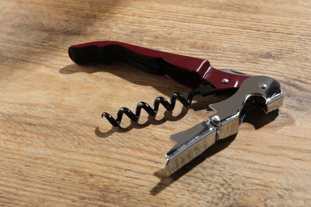 One corkscrew (sommelier knife) on wooden tableの写真素材