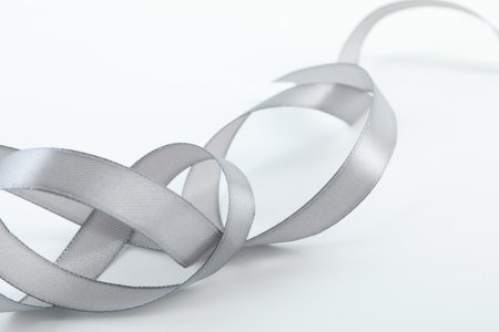 One beautiful gray ribbon isolated on whiteの写真素材