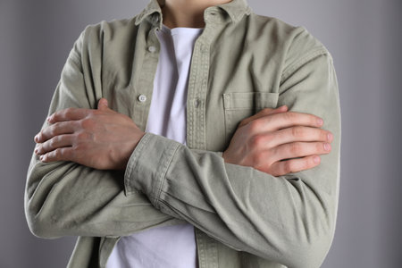 Man with space for tattoo on his hands against gray background, closeupの写真素材