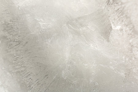 Crystal clear ice as background, closeup view