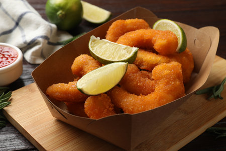 Delicious breaded fried shrimps and lime on table, closeupの写真素材