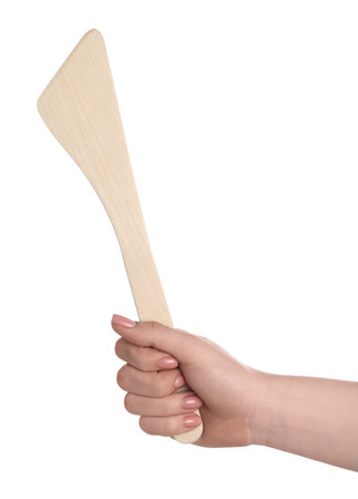 Woman with wooden spatula on white background, closeupの写真素材