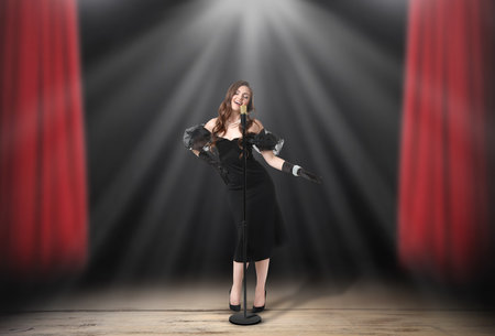 Beautiful singer performing in spotlight on stage