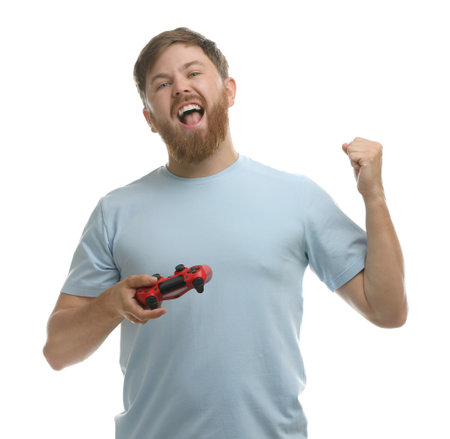 Emotional man with game controller on white background