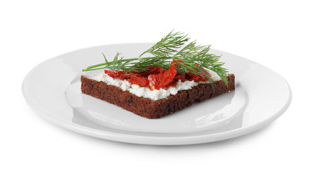 Delicious bruschetta with fresh ricotta (cream cheese), dill and sun-dried tomatoes isolated on whiteの写真素材