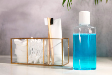 Bottle of mouthwash on white table in bathroomの写真素材