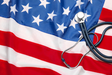 Stethoscope on USA flag, top view. Health care conceptの写真素材