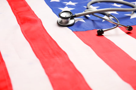 Stethoscope on USA flag, closeup. Health care conceptの写真素材