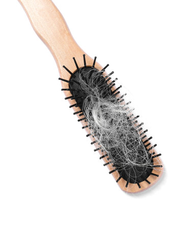 Wooden brush with lost hair isolated on white, top view