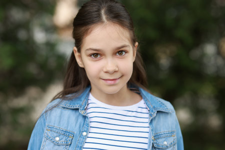 Portrait of beautiful little girl outdoors. Cute childの写真素材
