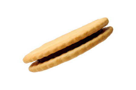 One tasty sandwich cookie isolated on whiteの写真素材