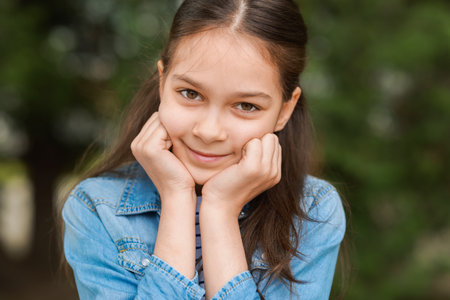 Portrait of beautiful little girl outdoors. Cute childの写真素材