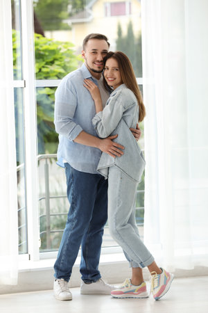 Happy couple hugging at home. Strong relationshipの写真素材