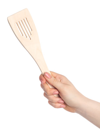 Woman with wooden spatula on white background, closeupの写真素材