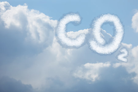 Blue sky with CO2 chemical formula and clouds. Carbon dioxide emissionsの写真素材
