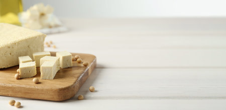 Delicious tofu and soybeans on white wooden table, space for text. Banner designの写真素材