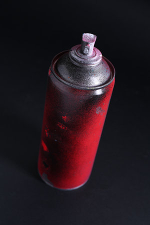 One spray paint can on dark background, closeupの写真素材